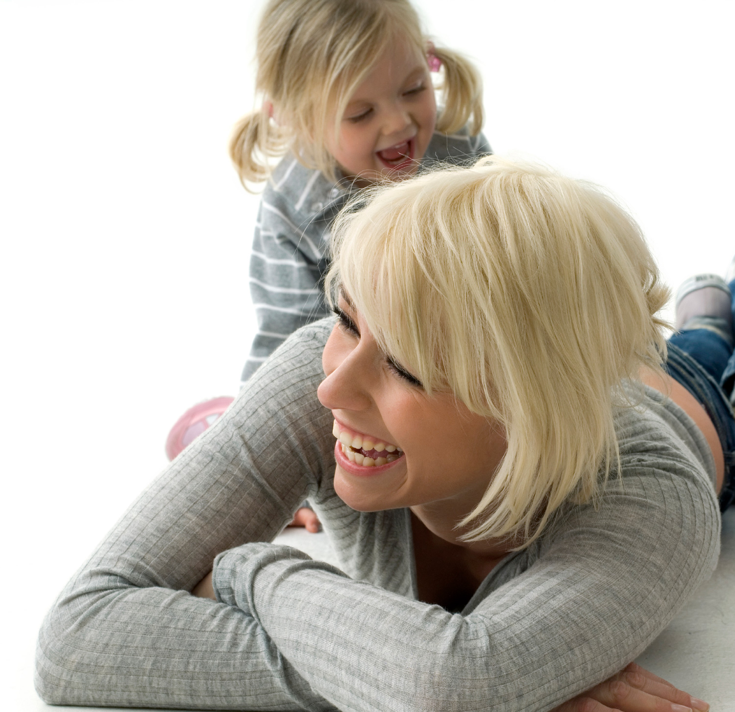 Model: laughing mother with child